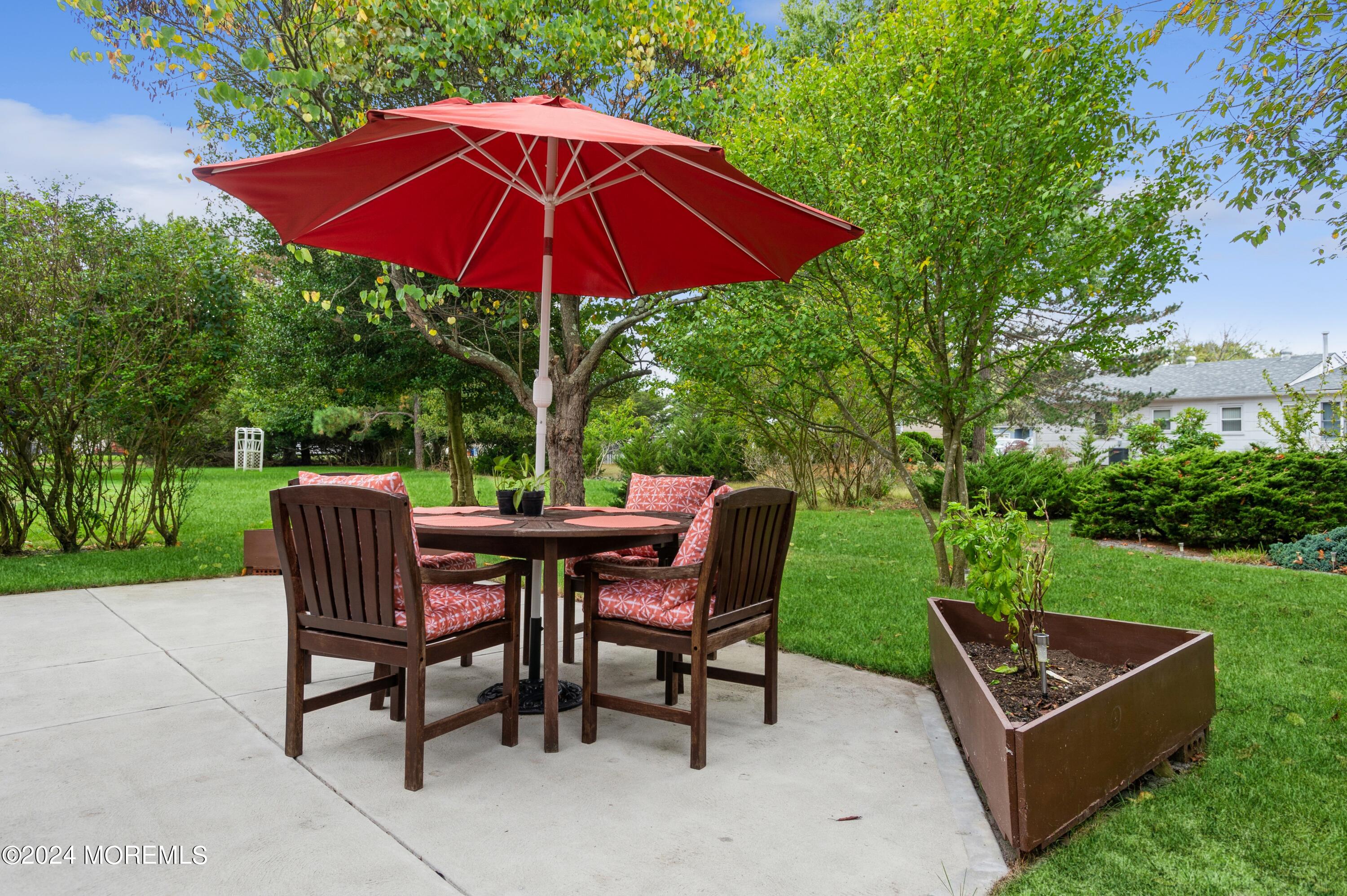 108 Georgetown Road Toms River, NJ 08757 - Photo 28 of 33 a view of backyard of house with seating space