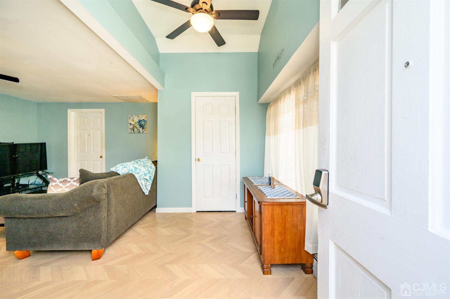 69 Bergerville Road Freehold, NJ 07728 - Photo 2 of 28 a living room with furniture and a flat screen tv