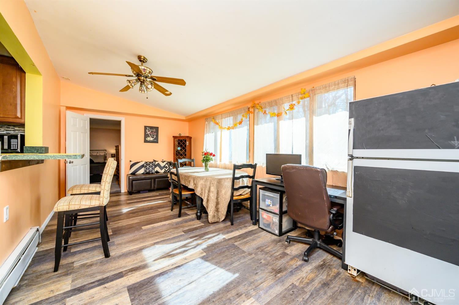 69 Bergerville Road Freehold, NJ 07728 - Photo 10 of 28 a living room with furniture and a wooden floor