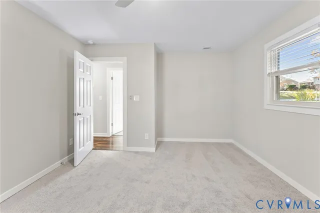 a view of an empty room and window