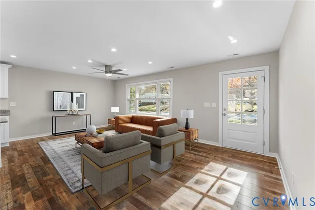 a living room with furniture and a window