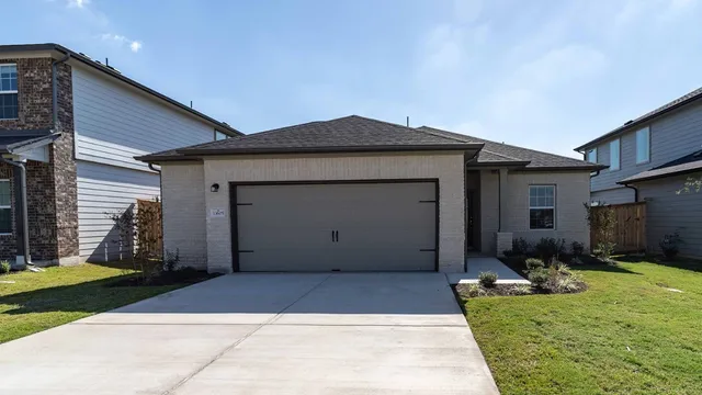a house view with a backyard space