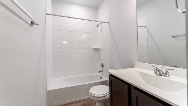 a bathroom with a sink a toilet and a bathtub