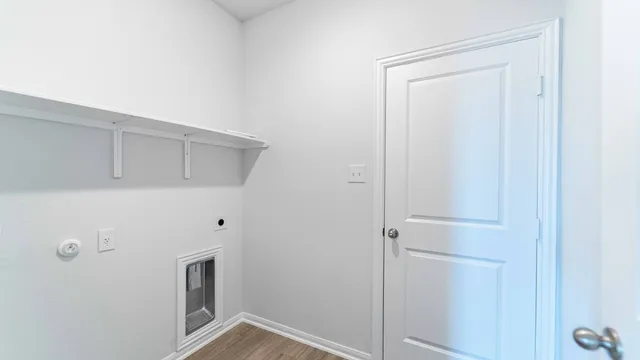a view of a hallway with washer and dryer