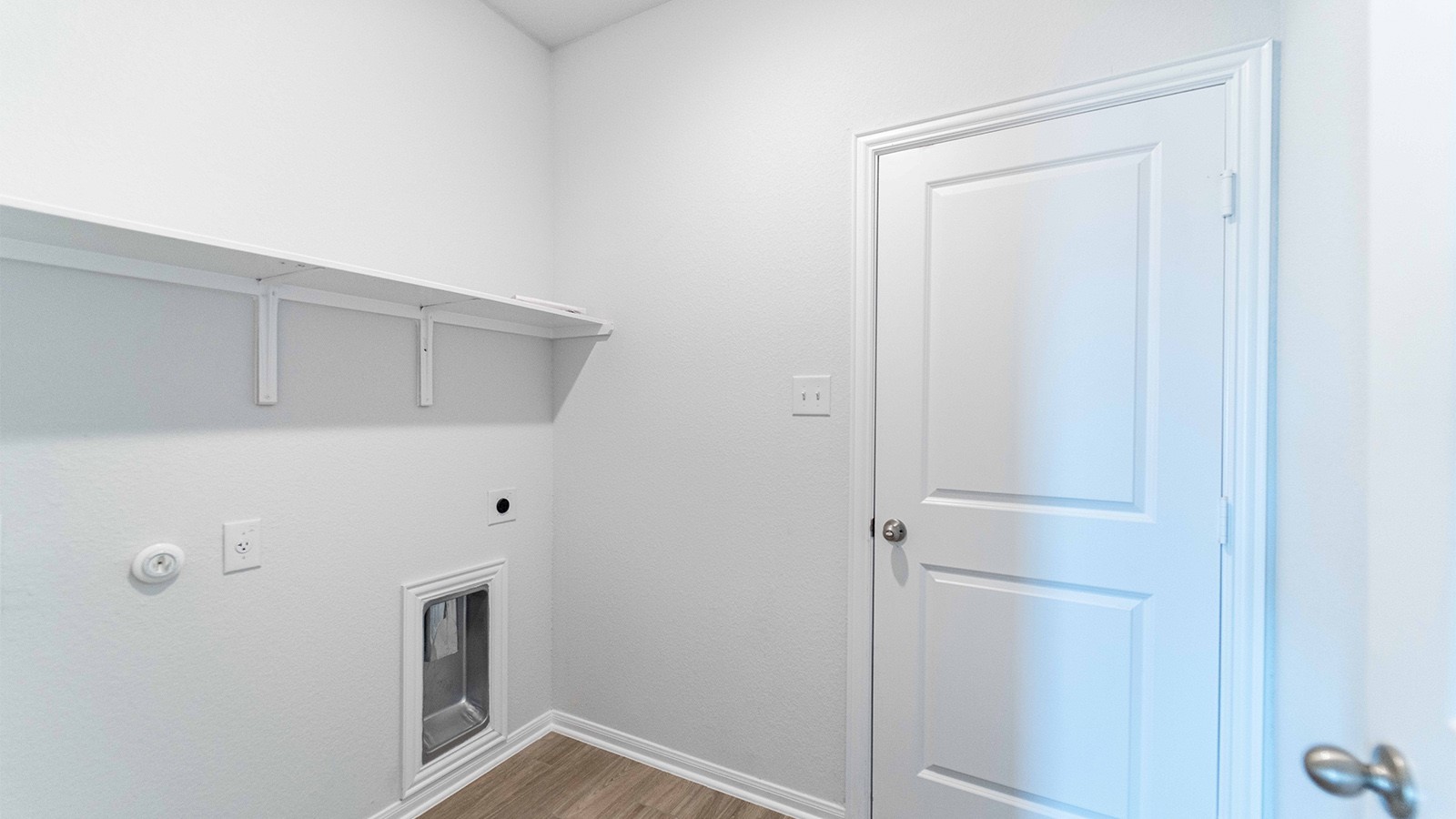 13605 Endless Narrow Lane Elgin, TX 78621 - Photo 14 of 16 a view of a hallway with washer and dryer