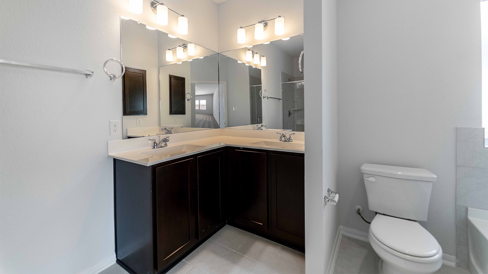 13605 Endless Narrow Lane Elgin, TX 78621 - Photo 2 of 16 a bathroom with a granite countertop sink toilet and mirror