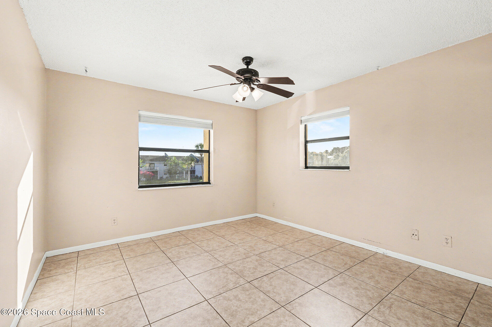 598 North Wickham Road, Unit 74 Melbourne, FL 32935 - Photo 11 of 13 a view of an empty room with a window