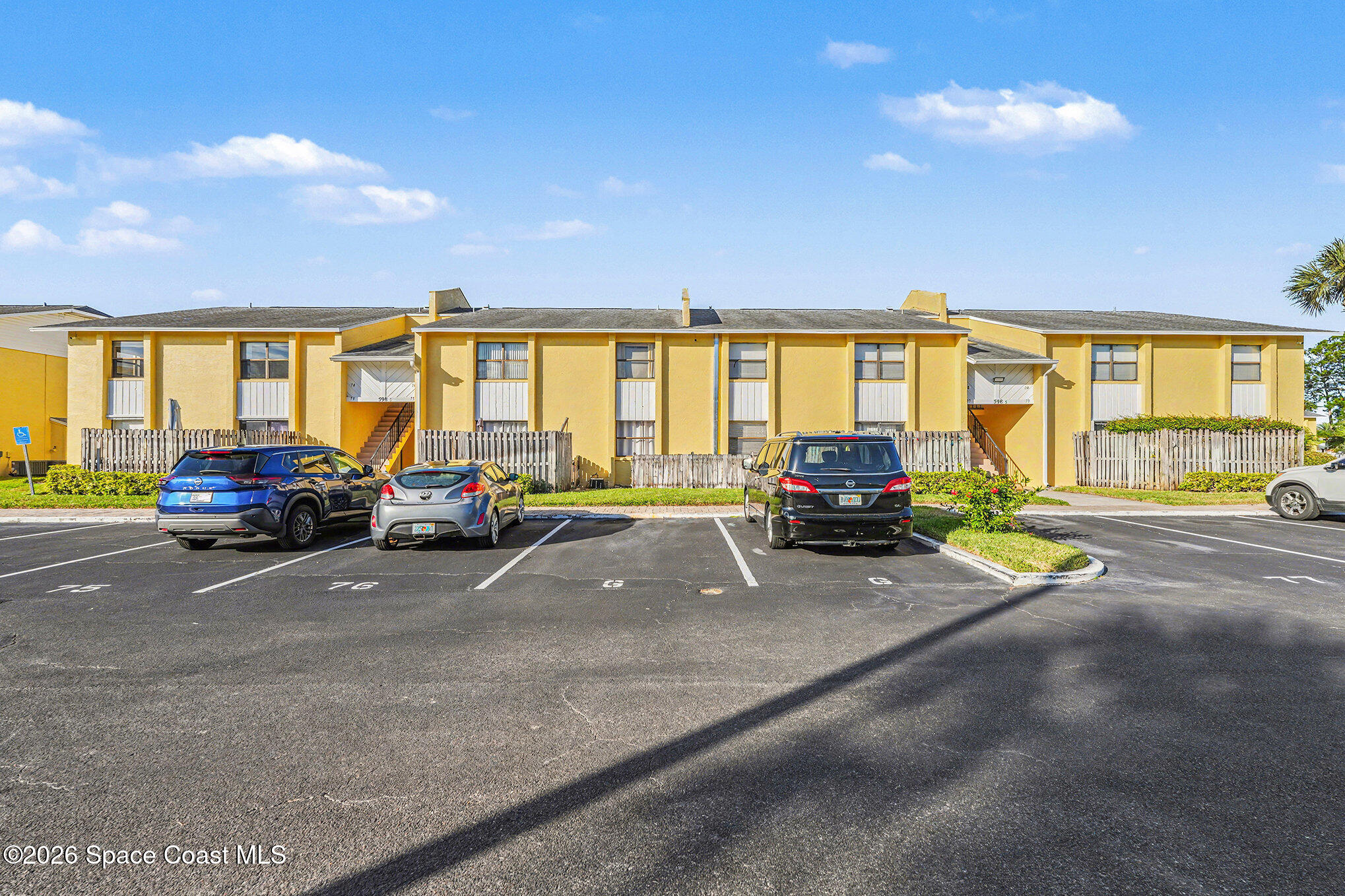 598 North Wickham Road, Unit 74 Melbourne, FL 32935 - Photo 2 of 13 a view of a car parked in front of a house