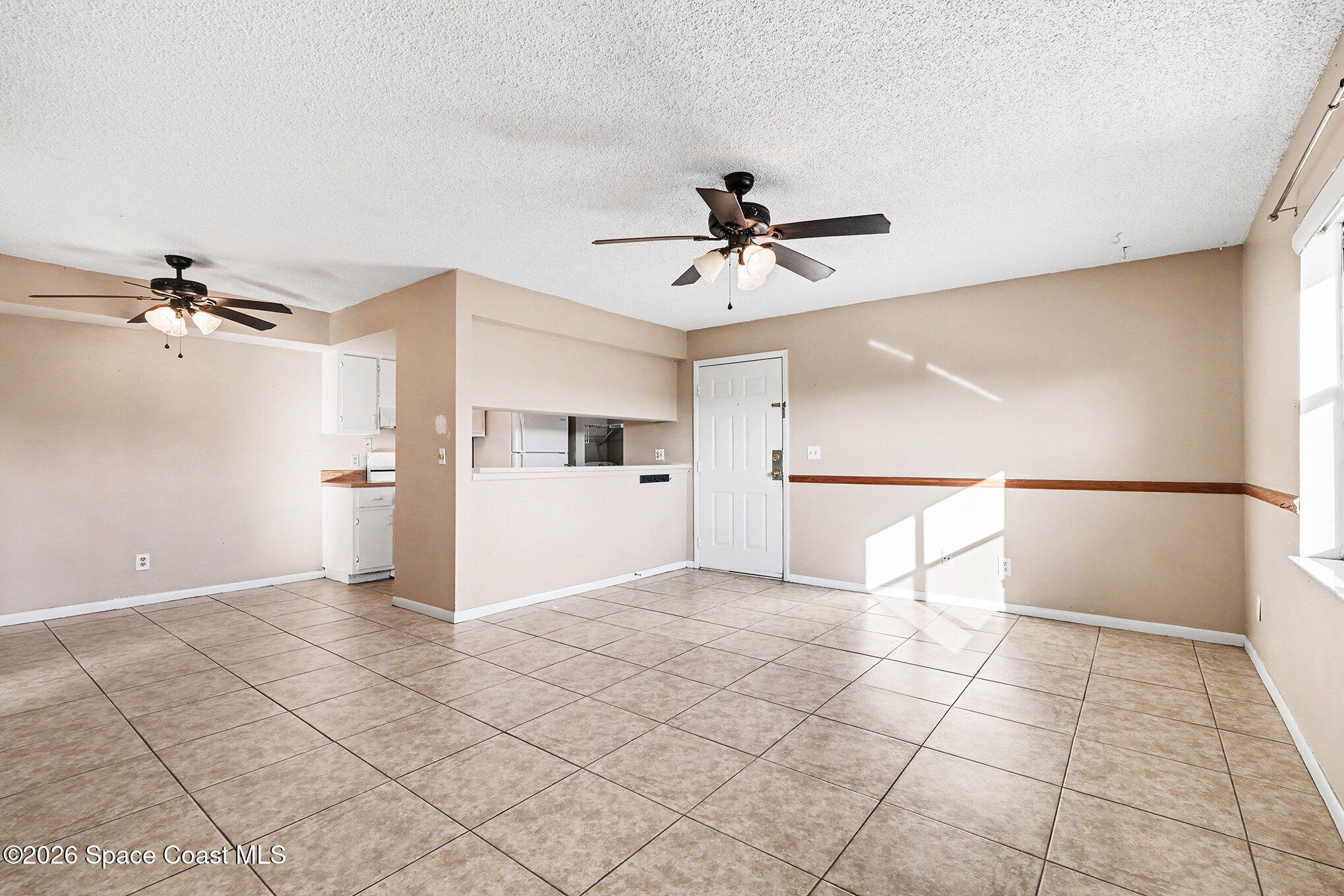 598 North Wickham Road, Unit 74 Melbourne, FL 32935 - Photo 4 of 13 a view of a livingroom with a staircase