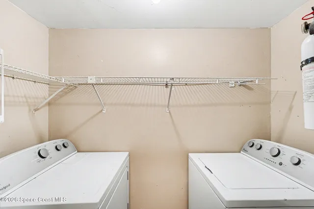 a utility room with dryer and washer