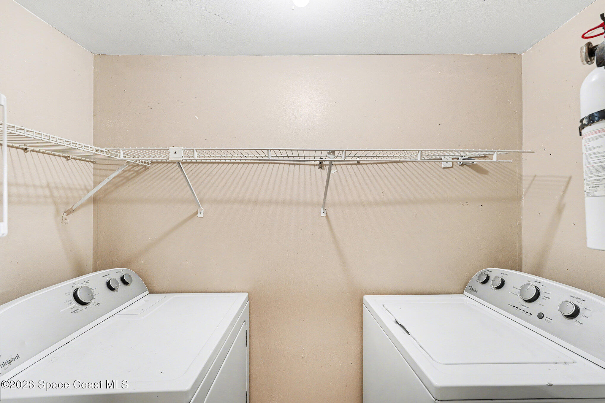 598 North Wickham Road, Unit 74 Melbourne, FL 32935 - Photo 8 of 13 a utility room with dryer and washer