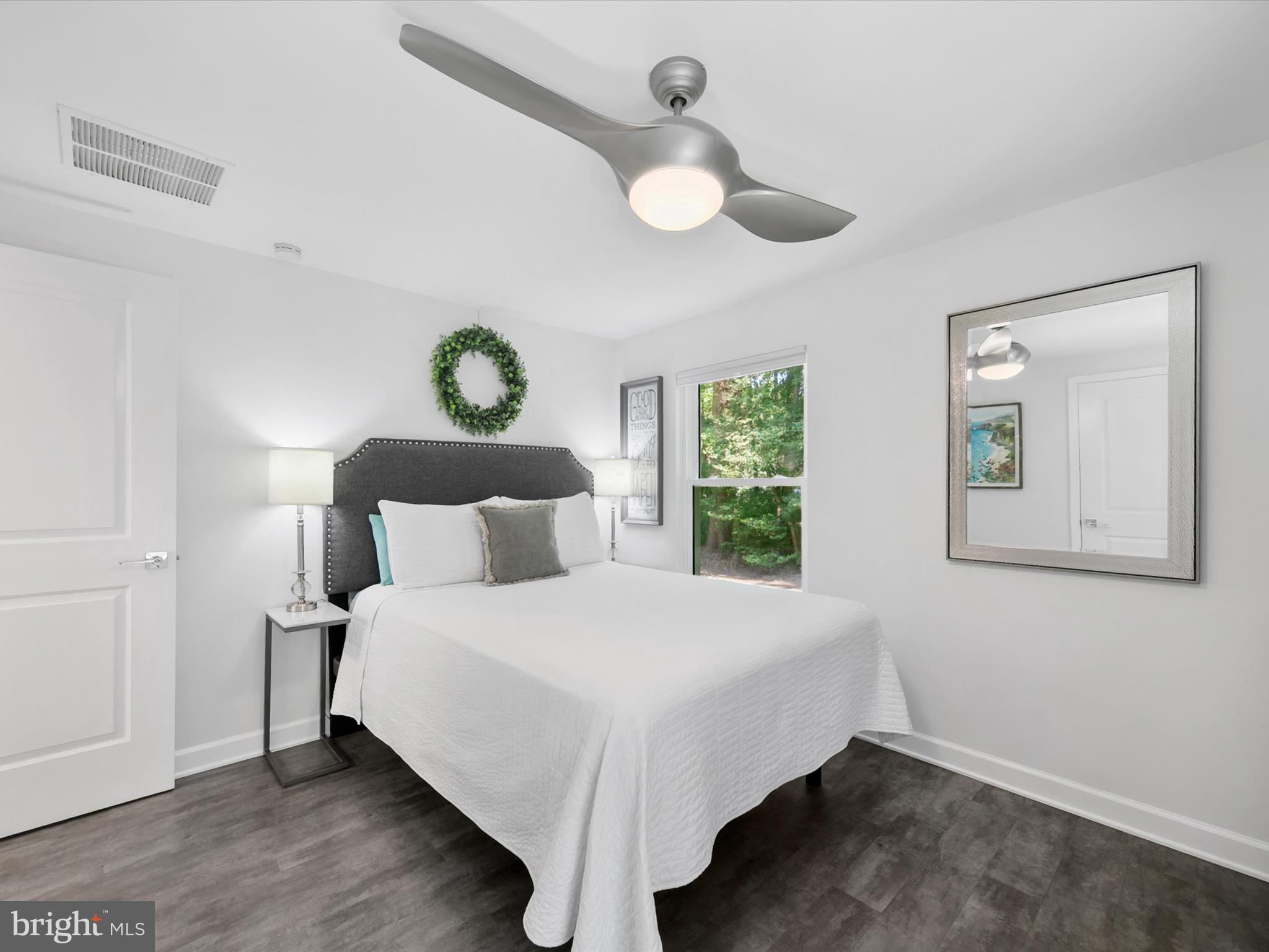 26076 Anderson Corner Road Georgetown, DE 19947 - Photo 15 of 36 a bedroom with a bed and window