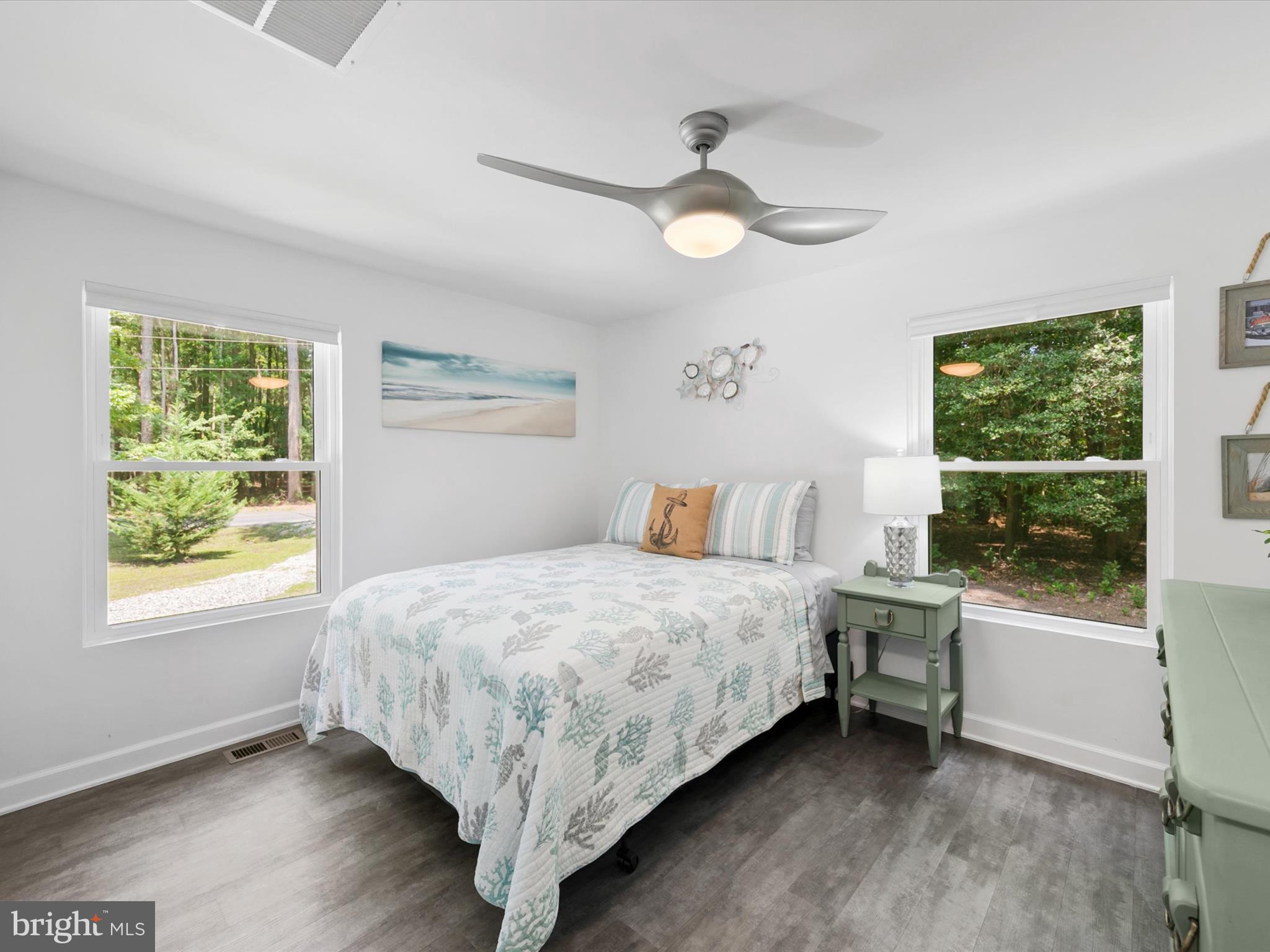 26076 Anderson Corner Road Georgetown, DE 19947 - Photo 19 of 36 a bedroom with a bed and a window