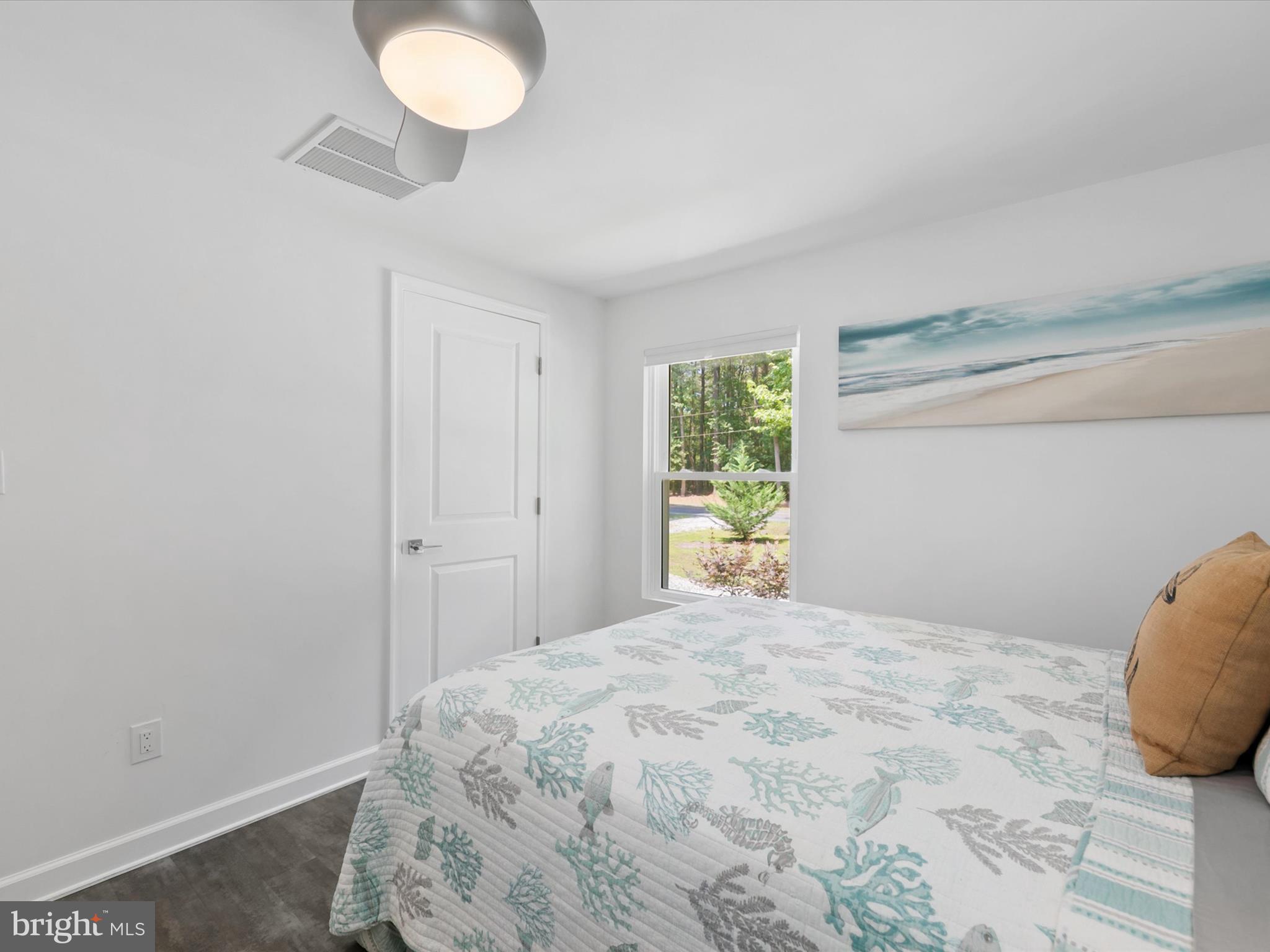 26076 Anderson Corner Road Georgetown, DE 19947 - Photo 20 of 36 a bedroom with a bed and a window