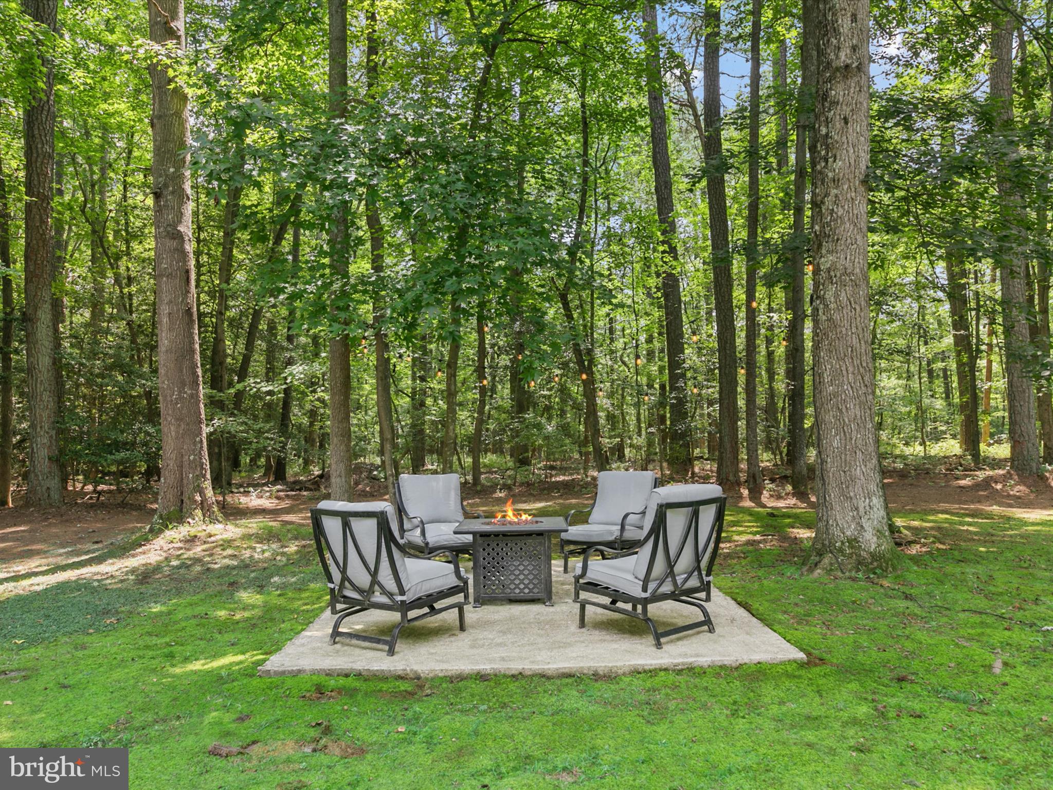 26076 Anderson Corner Road Georgetown, DE 19947 - Photo 28 of 36 a view of a backyard with sitting area