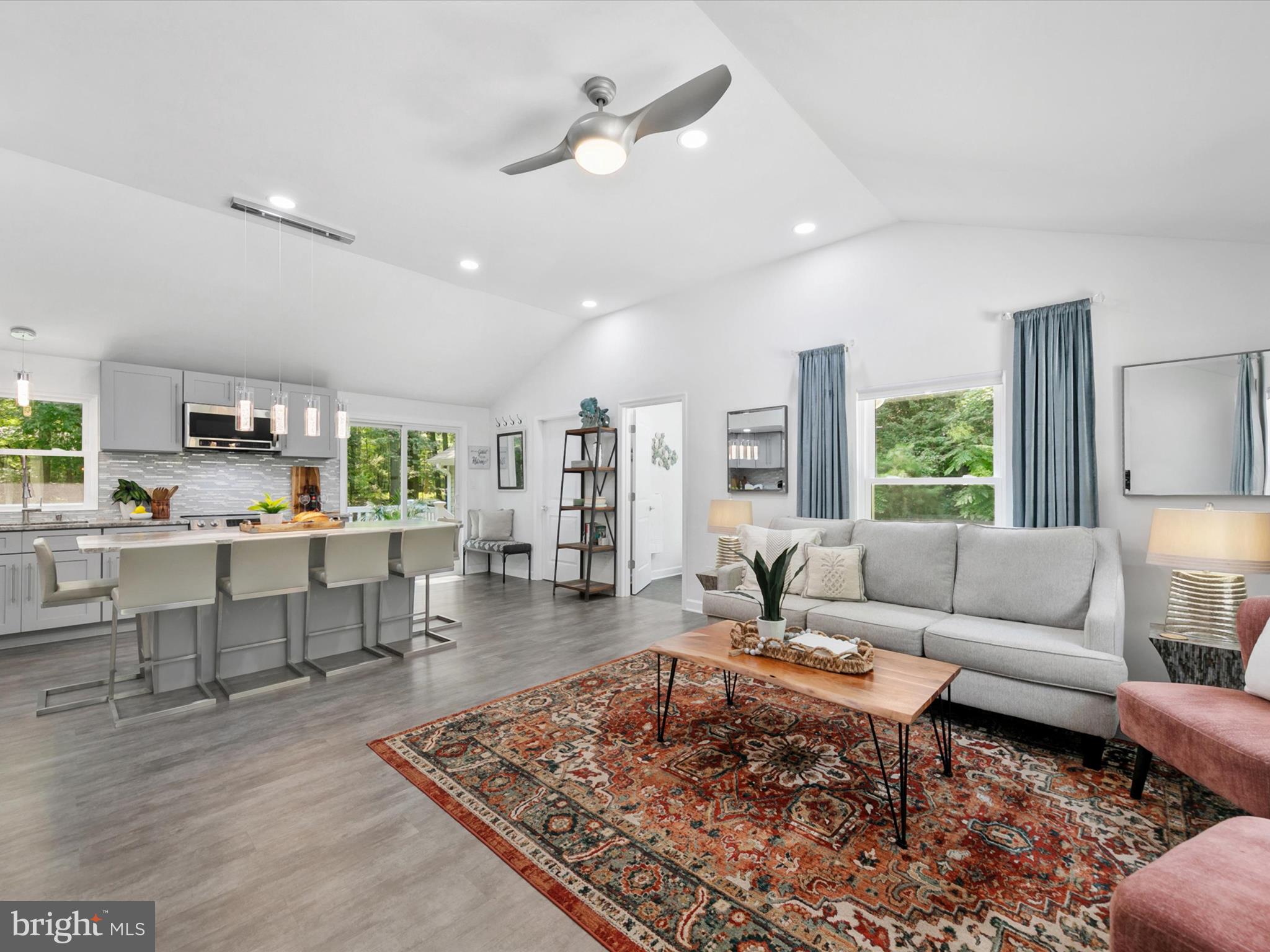 26076 Anderson Corner Road Georgetown, DE 19947 - Photo 3 of 36 a living room with furniture wooden floor and a table