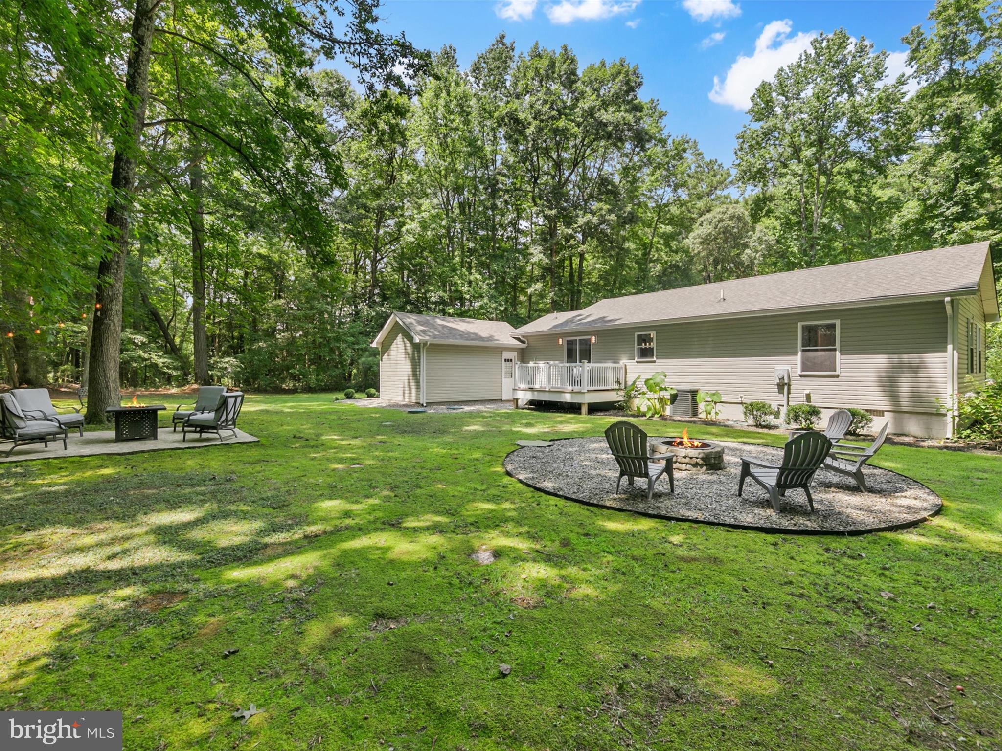 26076 Anderson Corner Road Georgetown, DE 19947 - Photo 32 of 36 a front view of house with a garden and patio