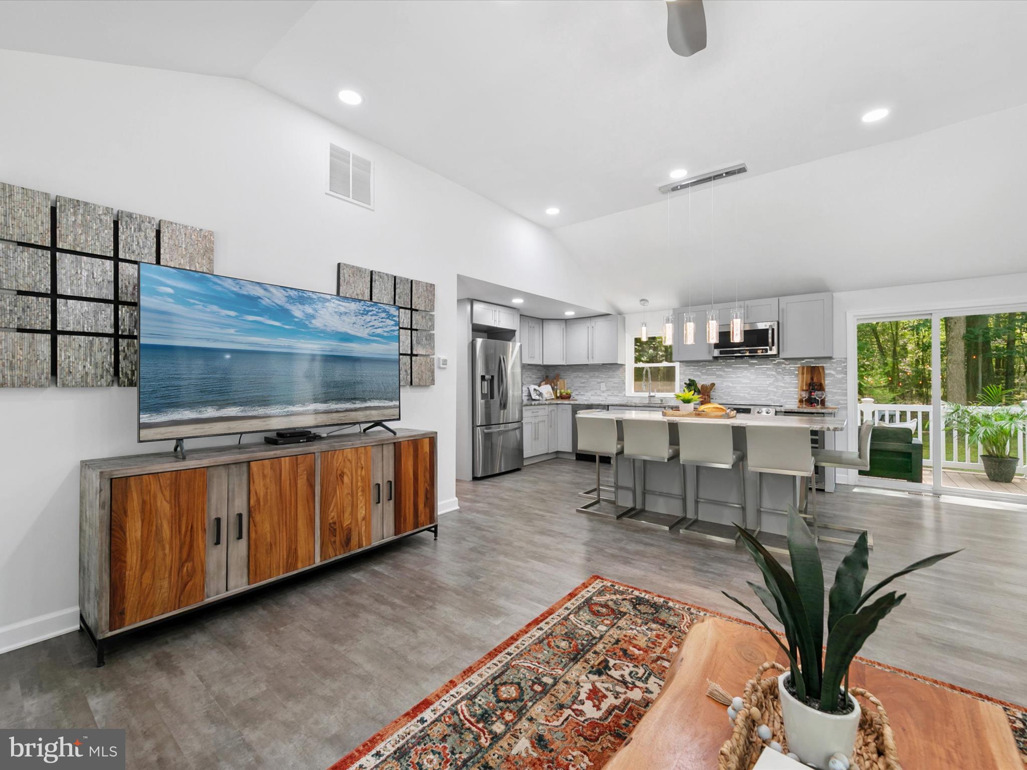 26076 Anderson Corner Road Georgetown, DE 19947 - Photo 6 of 36 a living room with furniture and a flat screen tv