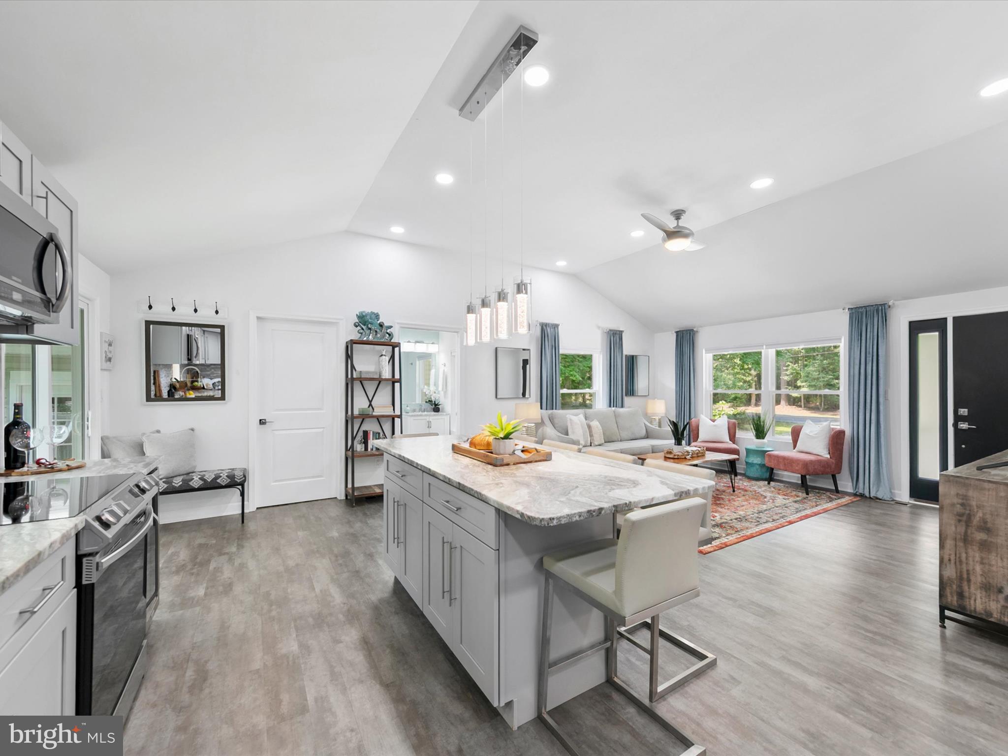 26076 Anderson Corner Road Georgetown, DE 19947 - Photo 10 of 36 a kitchen with stainless steel appliances granite countertop a stove and cabinets