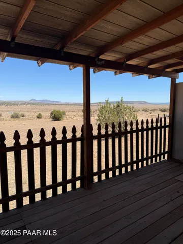 a view of a hallway with a window