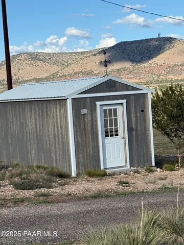 a view of hallway with furniture and a window