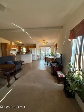 a room with furniture and a large window