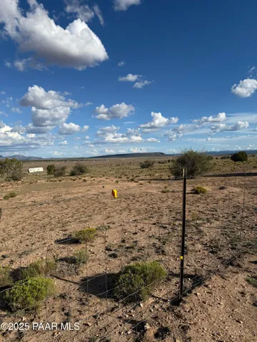 a view of an empty room and a window