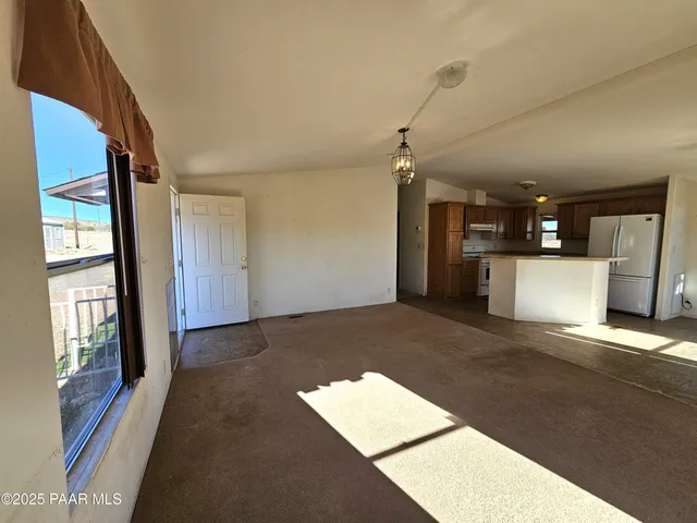 a kitchen with a stove and a refrigerator