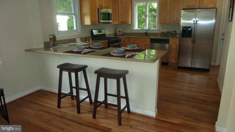 3408 Murdock Road Kensington, MD 20895 - Photo 12 of 12 The kitchen features a large breakfast bar