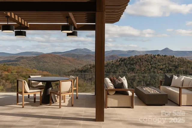 a view of a terrace with couches and sky view