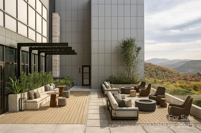 a view of a patio with couches and potted plants