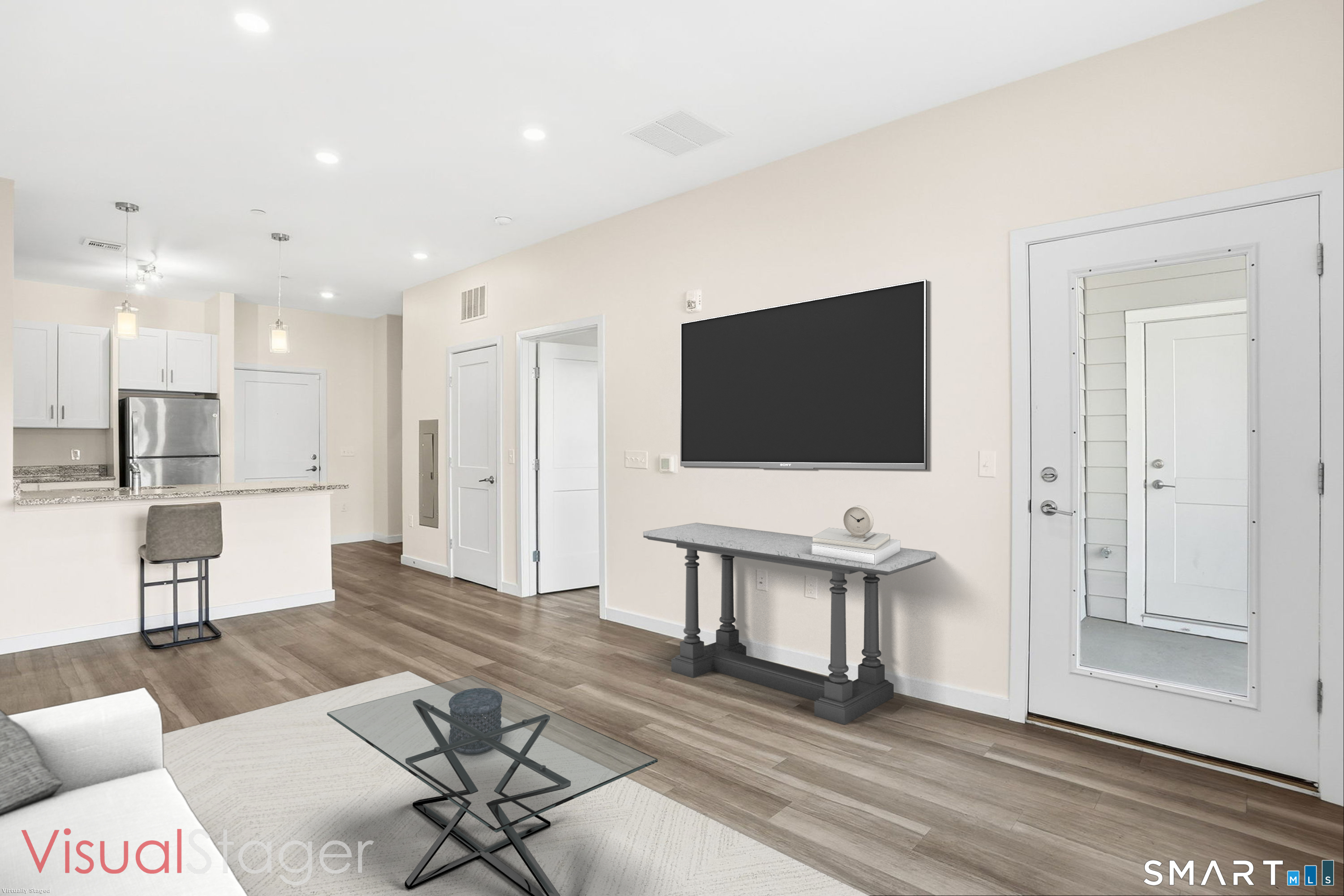 71 Connecticut Avenue, Unit 206 Norwalk, CT 06850 - Photo 12 of 17 a living room with furniture and a flat screen tv