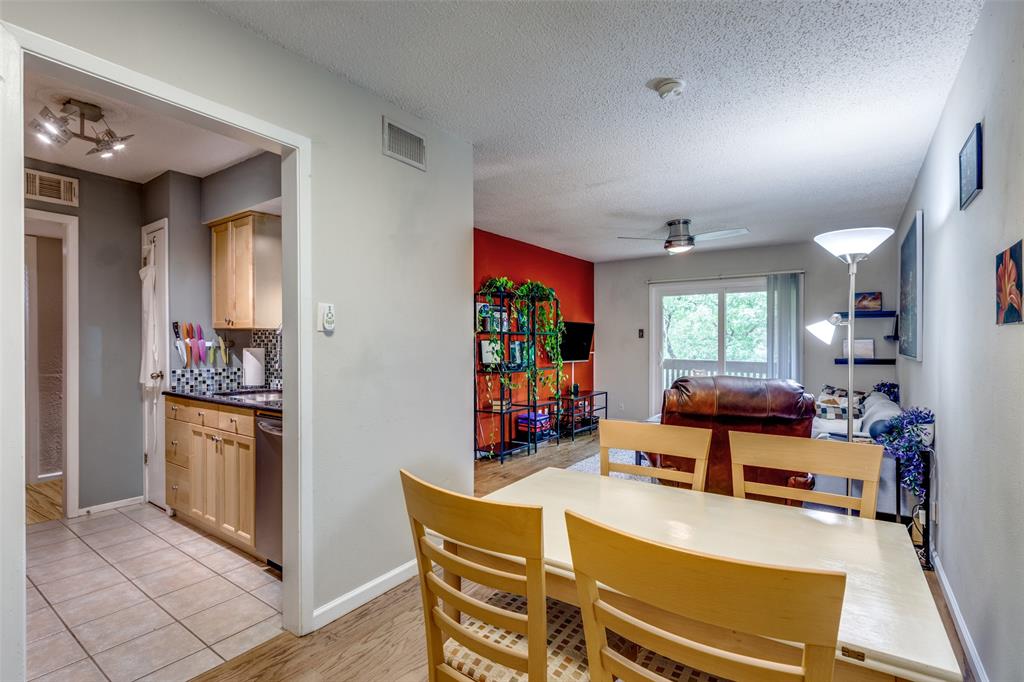4845 Cedar Springs Road, Unit 368 Dallas, TX 75219 - Photo 14 of 38 a living room with furniture and a flat screen tv