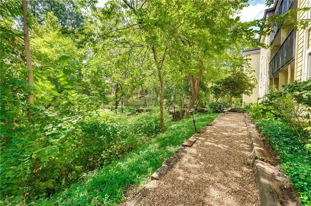 4845 Cedar Springs Road, Unit 368 Dallas, TX 75219 - Photo 32 of 38 a view of a pathway both side of yard