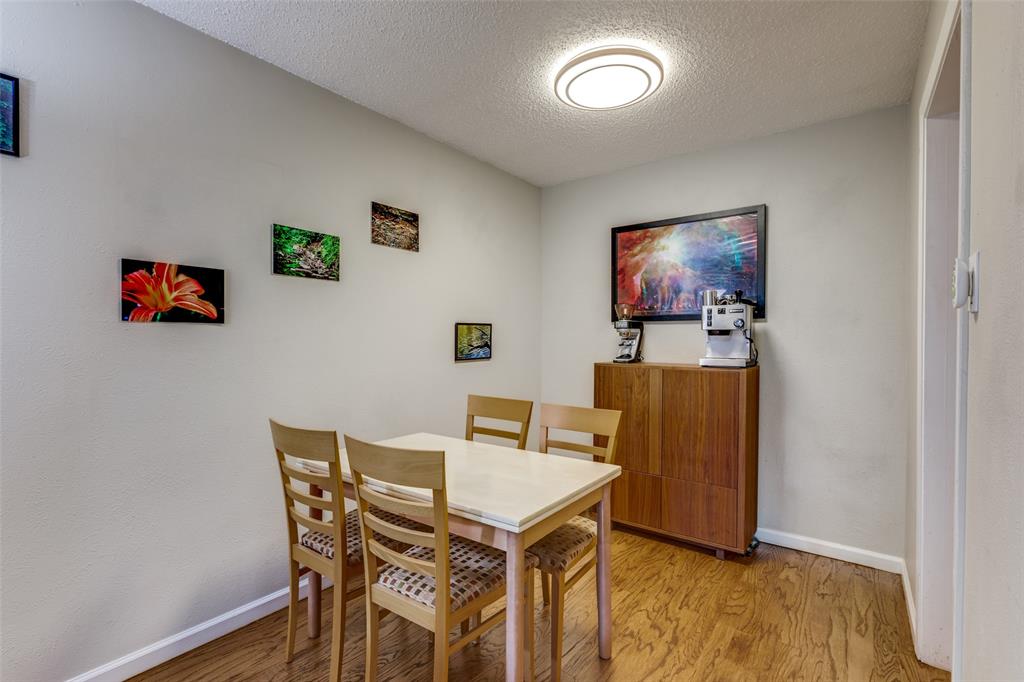 4845 Cedar Springs Road, Unit 368 Dallas, TX 75219 - Photo 8 of 38 a view of a livingroom with furniture and wooden floor