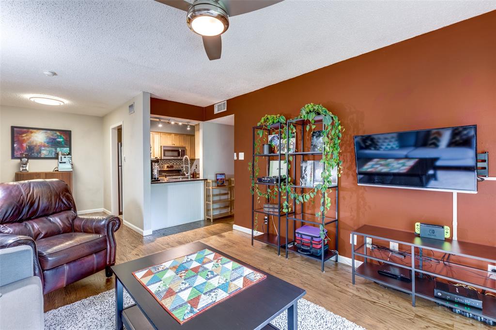 4845 Cedar Springs Road, Unit 368 Dallas, TX 75219 - Photo 10 of 38 a living room with furniture and a rug
