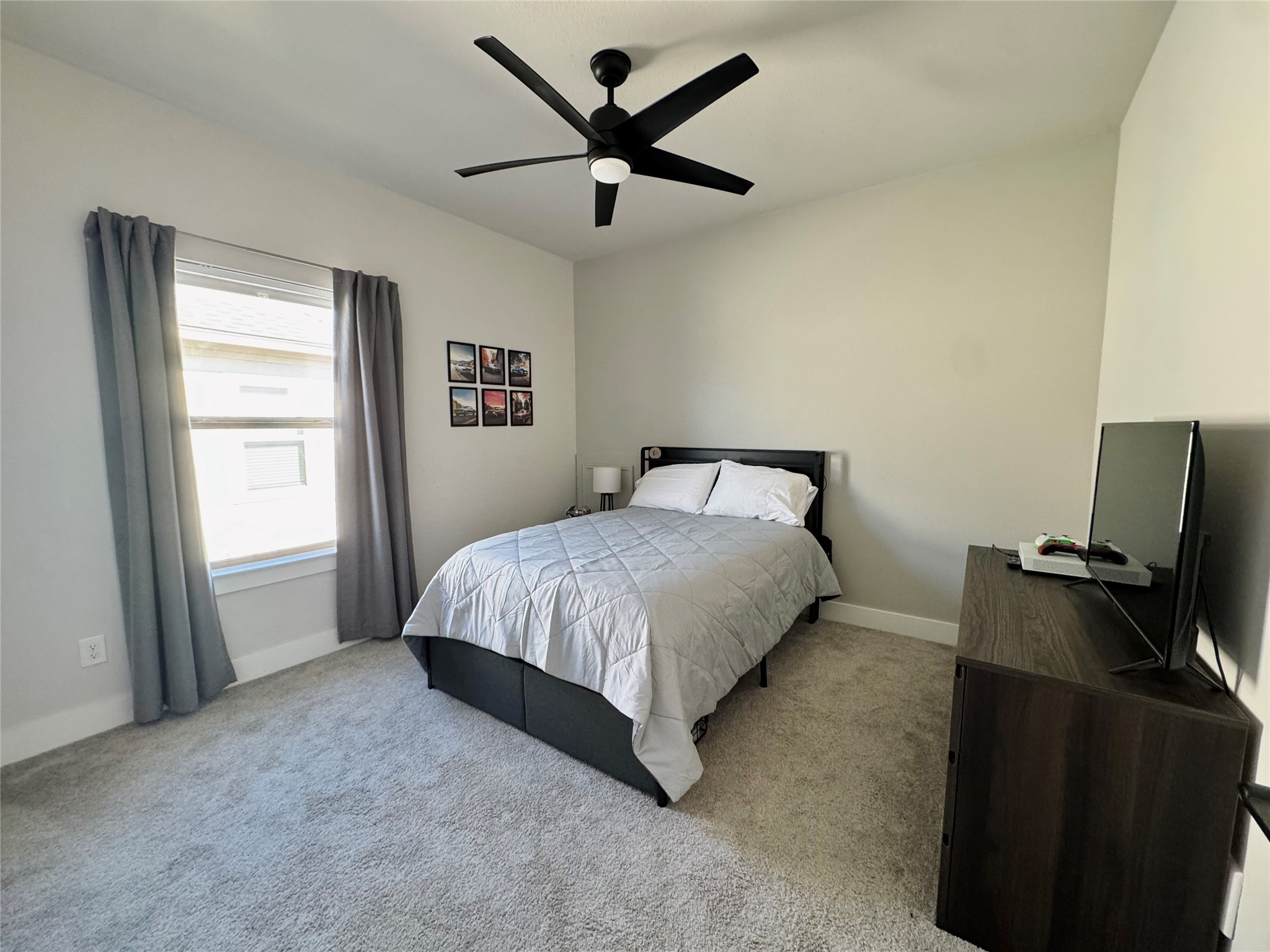 561 Cold Riv Run Kyle, TX 78640 - Photo 16 of 33 a bedroom with a bed and a window