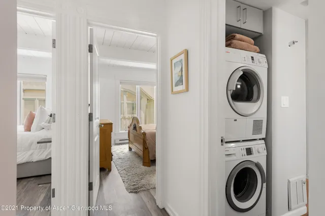 a view of a hallway with washer and dryer