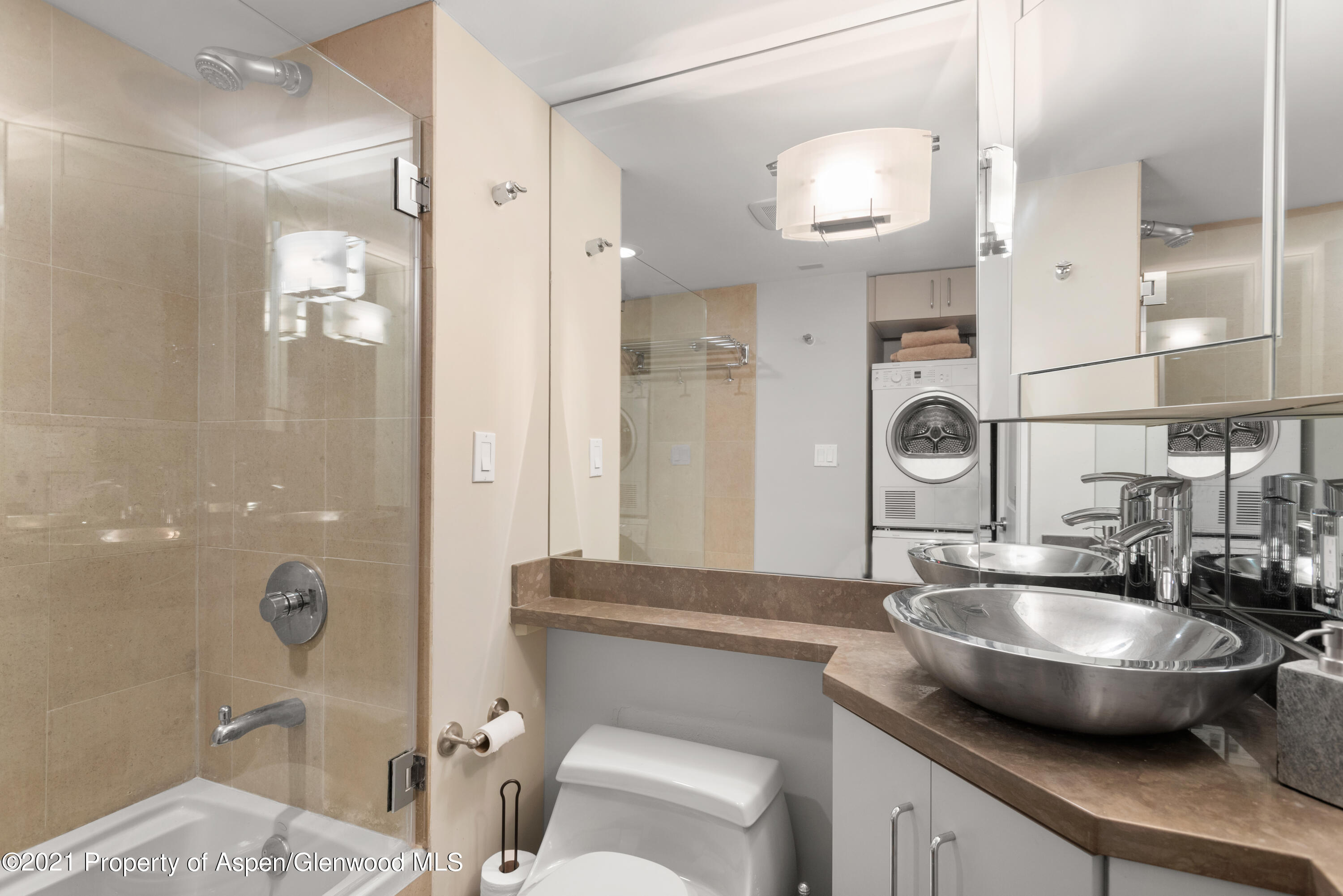 916 East Hopkins Avenue, Unit 204 Aspen, CO 81611 - Photo 9 of 14 a bathroom with a sink and a mirror