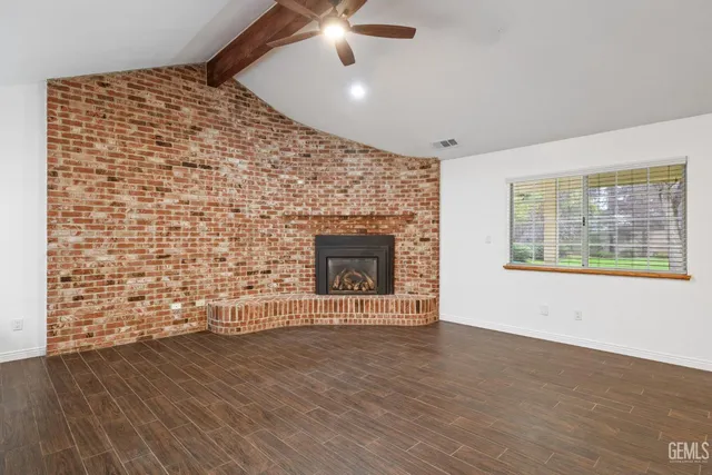 a kitchen with kitchen island a sink and a stove