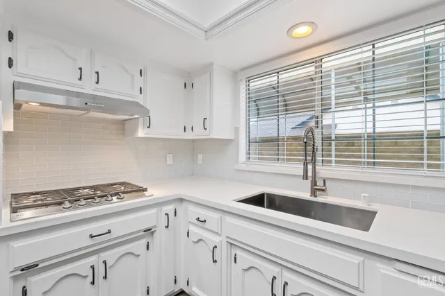 a bathroom with a sink a vanity and a mirror