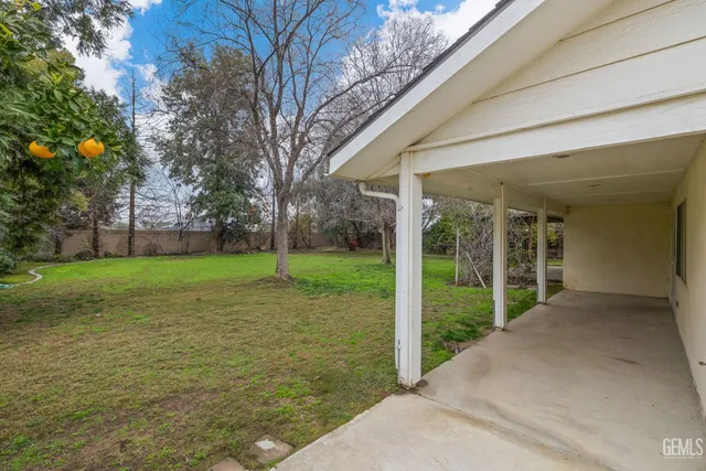 an aerial view of a house with yard