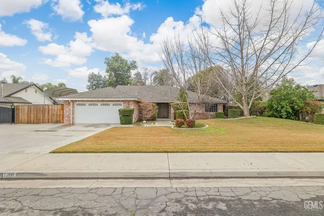 a front view of a house with a large window