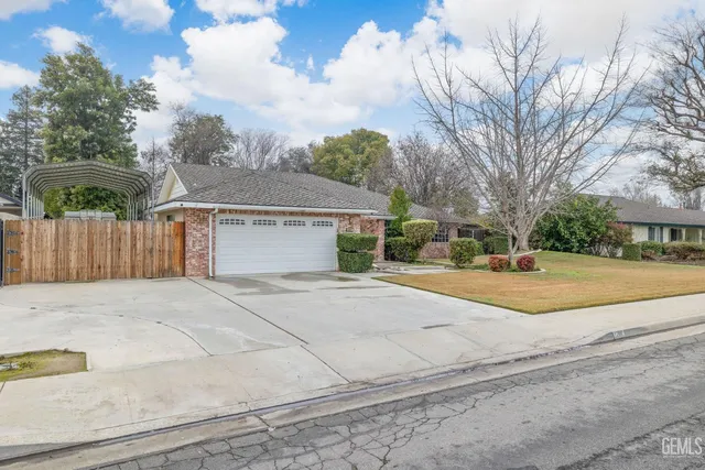 a view of a kitchen with wooden floor and electronic appliances