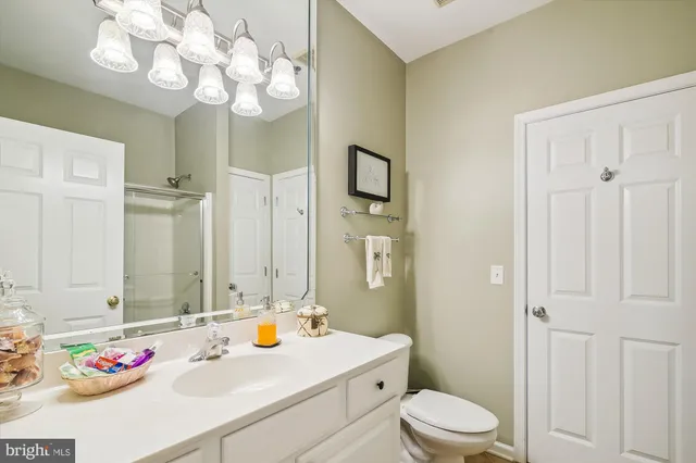 a bathroom with a sink vanity and a mirror