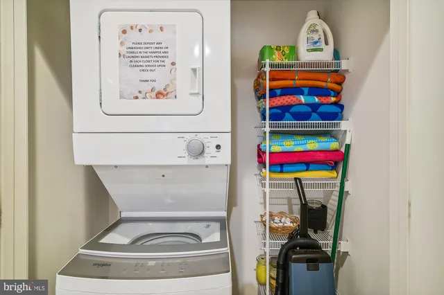 a balcony with table and chairs