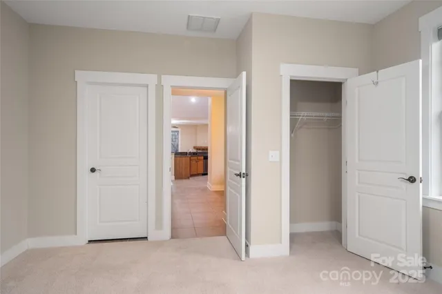 an empty room with closet area