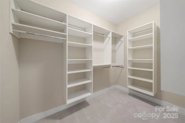a view of an empty walk in closet