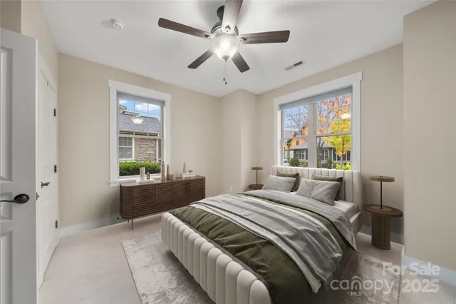 a bedroom with a large bed and a window