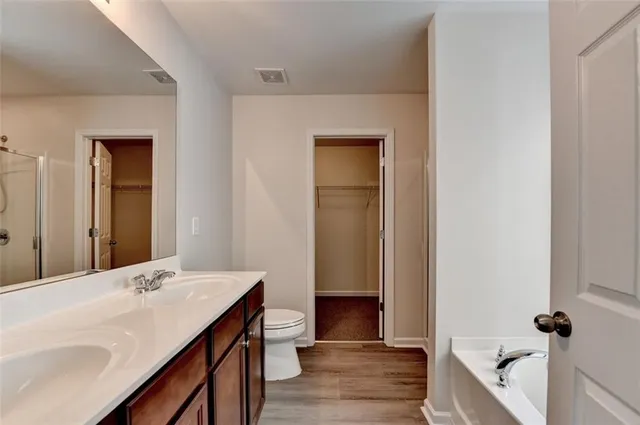 a bathroom with a sink a mirror and a shower